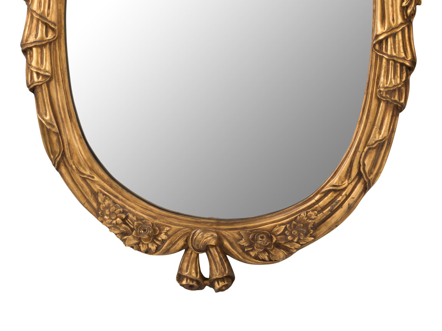 A Pair of Louis XV Style Giltwood Oval Mirrors