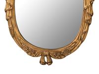 A Pair of Louis XV Style Giltwood Oval Mirrors