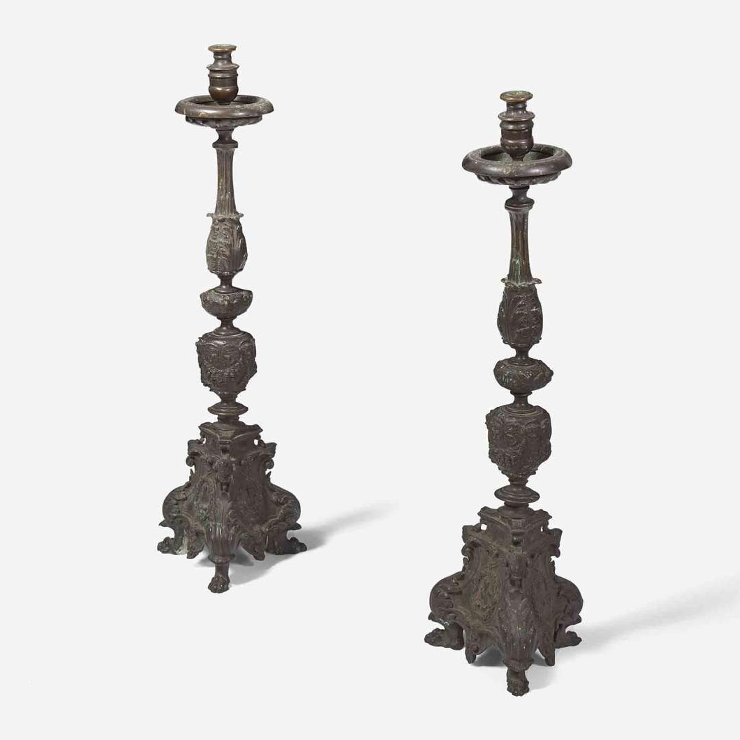 A pair of Italian Baroque patinated bronze candlesticks 19th century or earlier