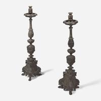 A pair of Italian Baroque patinated bronze candlesticks 19th century or earlier