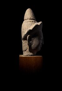 A Khmer Sandstone Head of a Deity