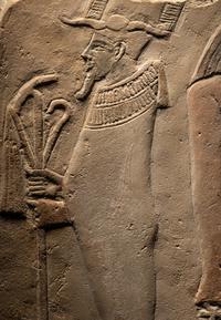 An Egyptian Limestone Round-Topped Stele