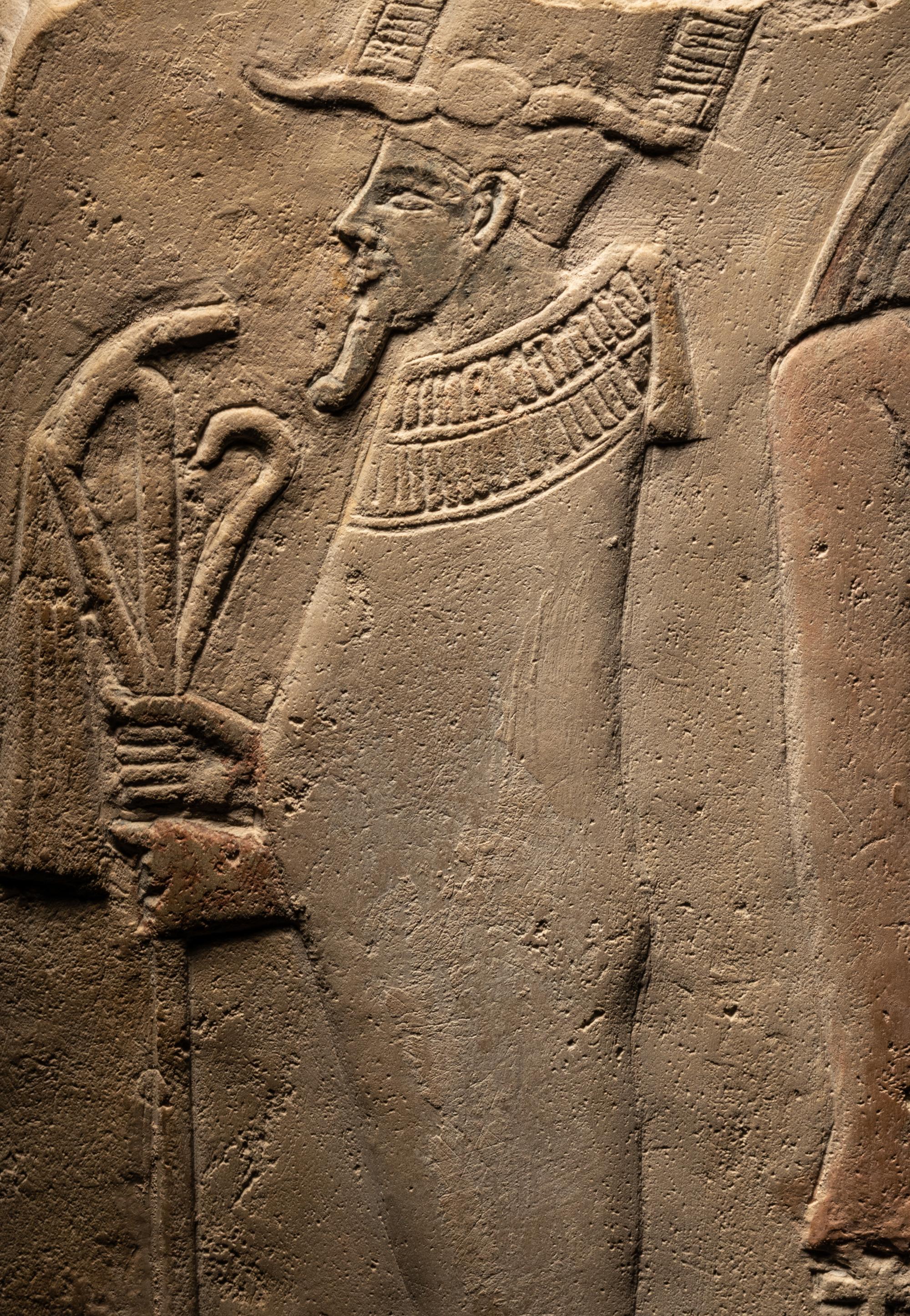 An Egyptian Limestone Round-Topped Stele