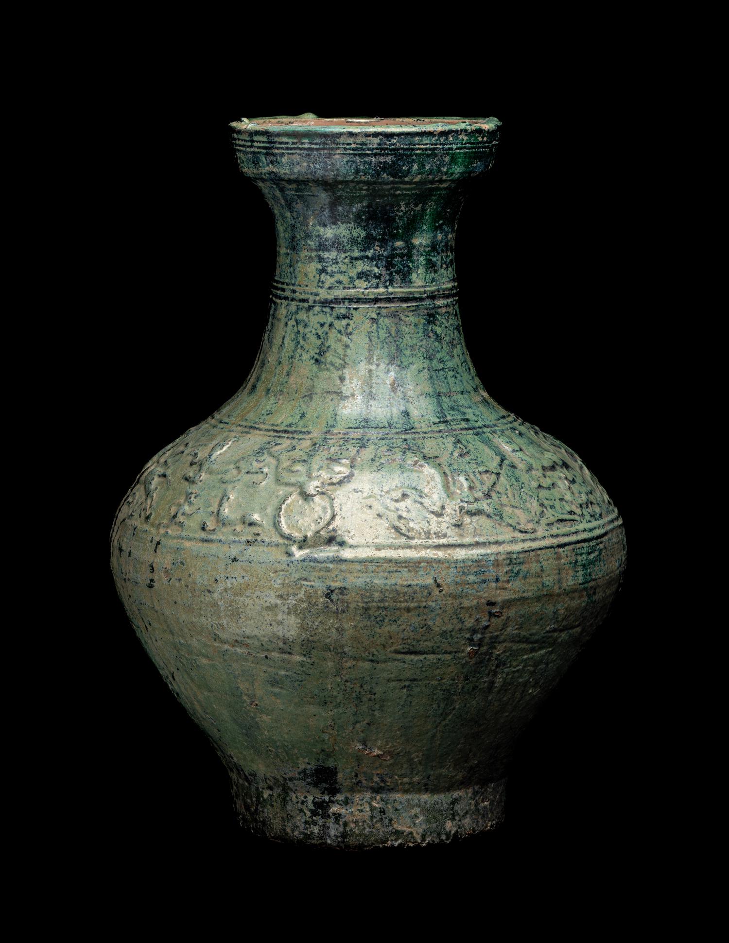 A Chinese Molded Green Glazed Pottery Hu Vase