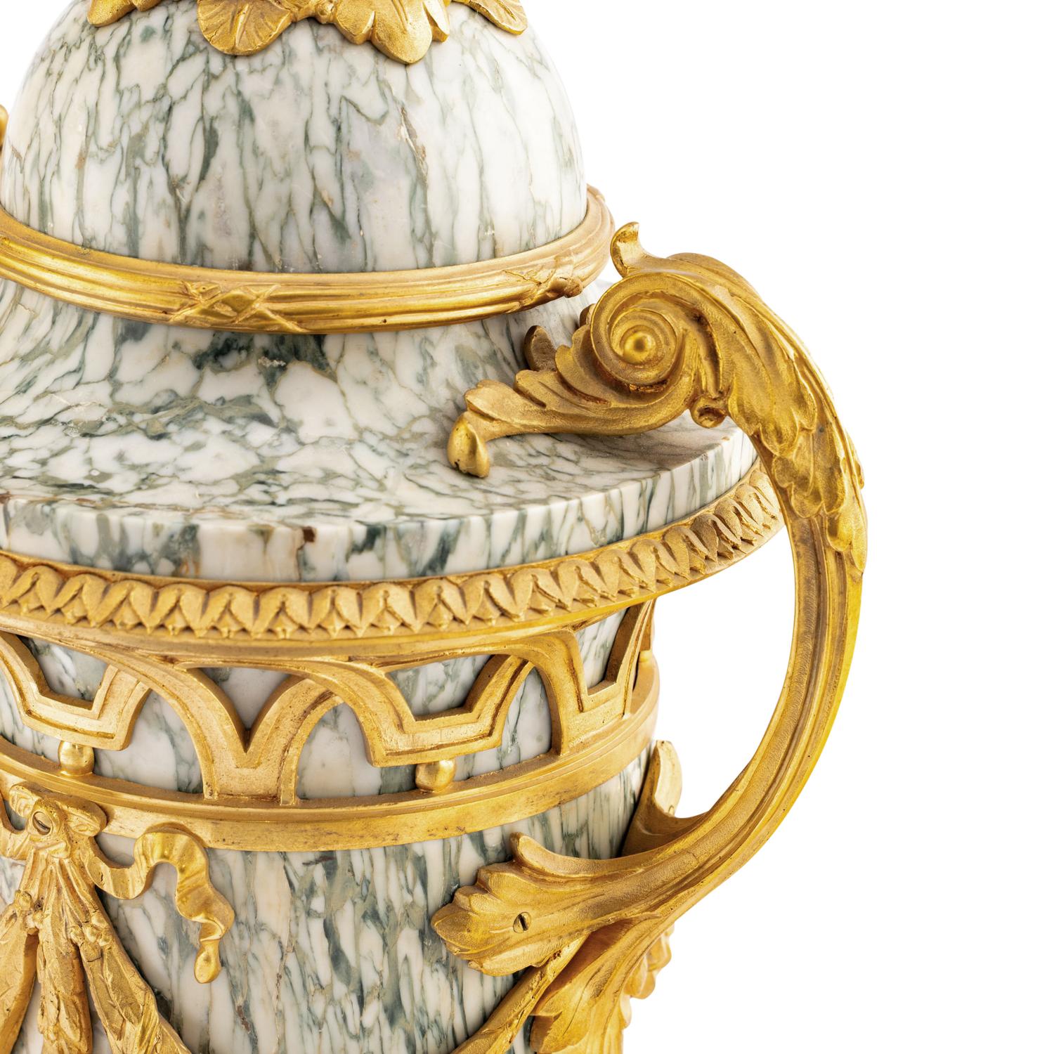 A Pair of Louis XVI Style Marble and Gilt Bronze Mounted Urns