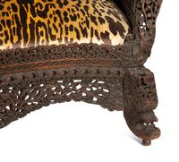 Two Similar Anglo-Burmese Carved Teak Settees
