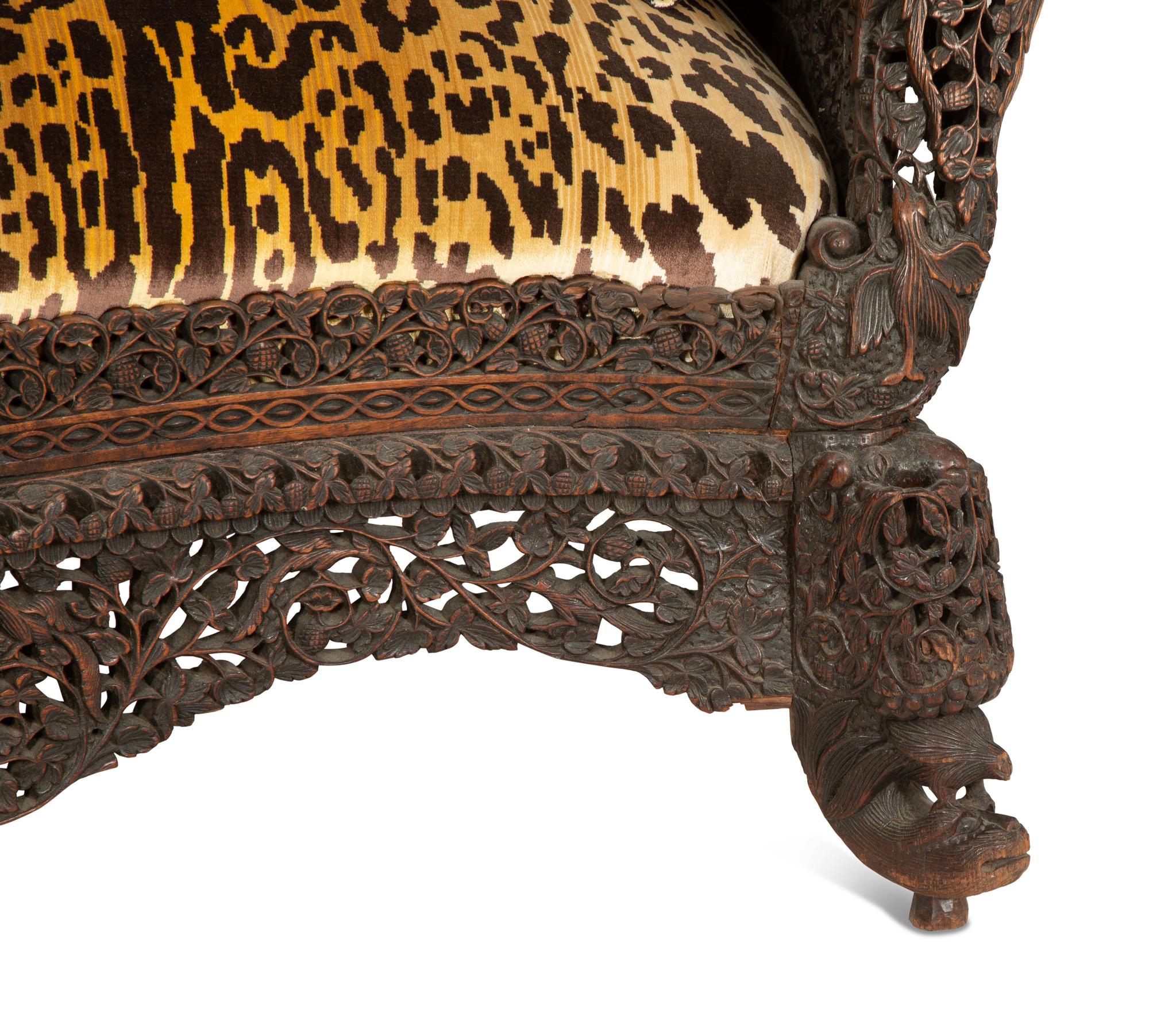 Two Similar Anglo-Burmese Carved Teak Settees