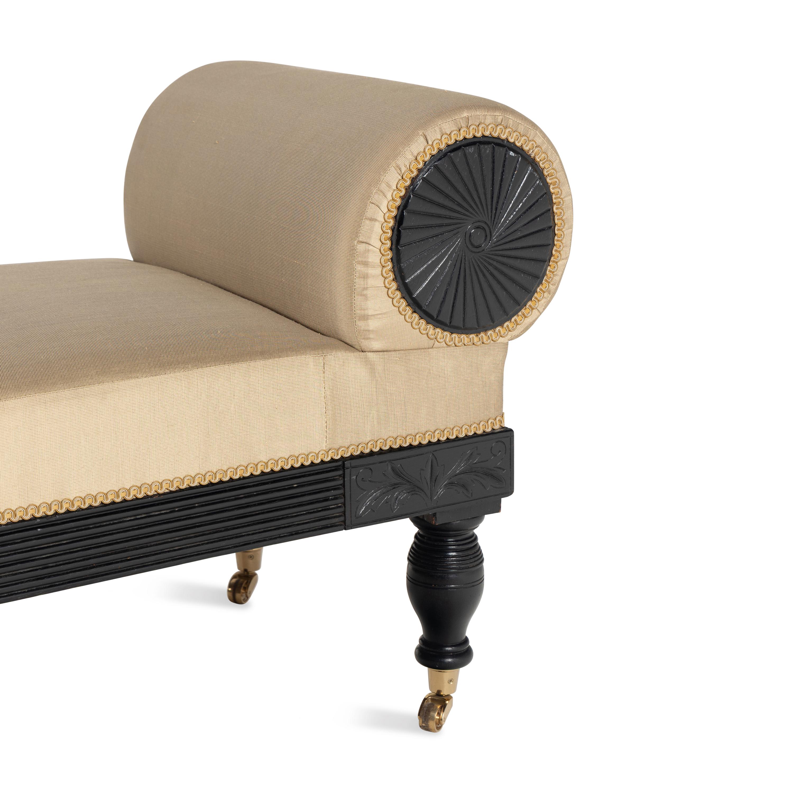 A Victorian Ebonized Chaise Longue