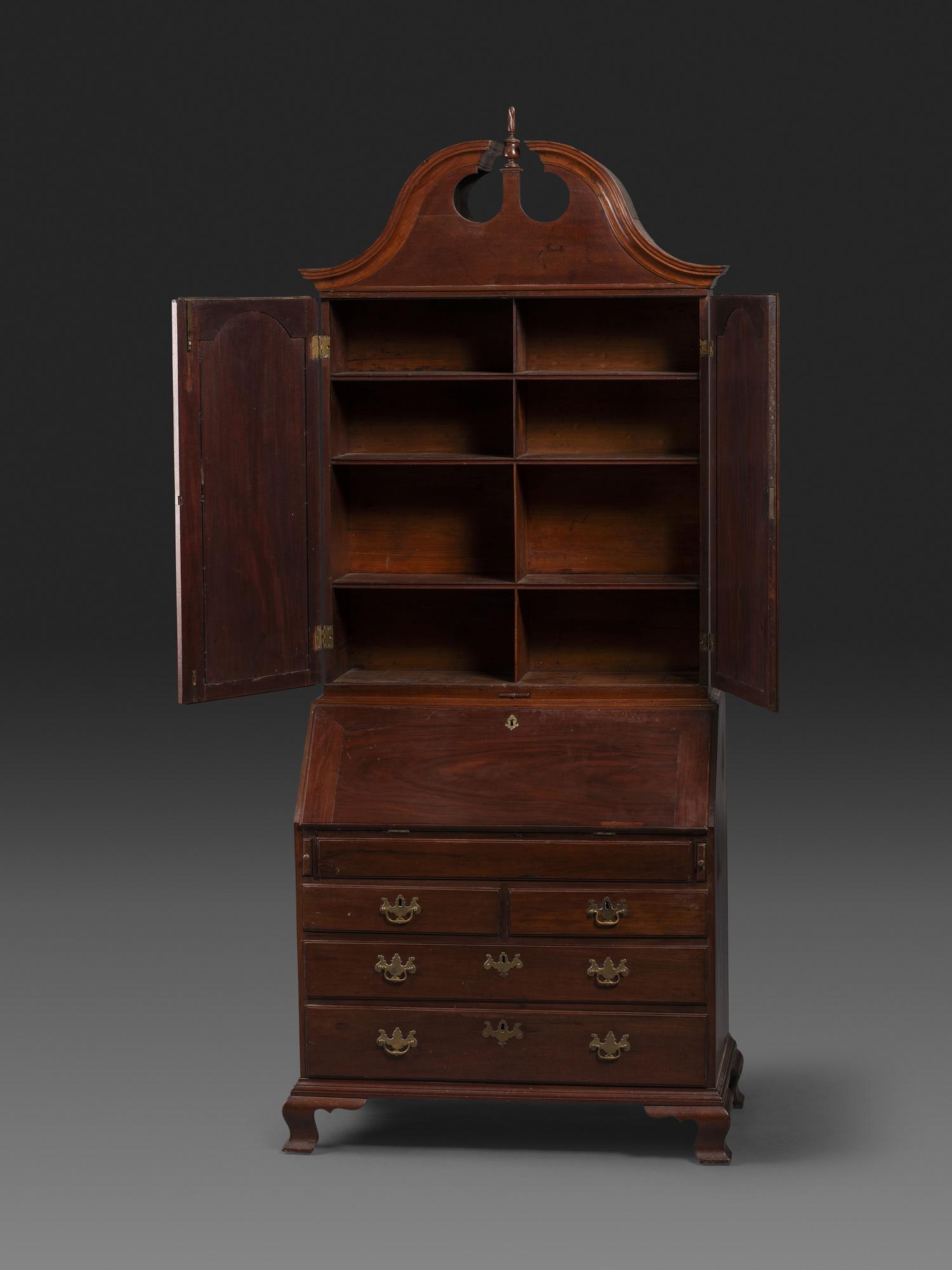 A Chippendale Figured Mahogany Bonnet Top Desk-and-Bookcase