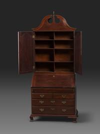 A Chippendale Figured Mahogany Bonnet Top Desk-and-Bookcase