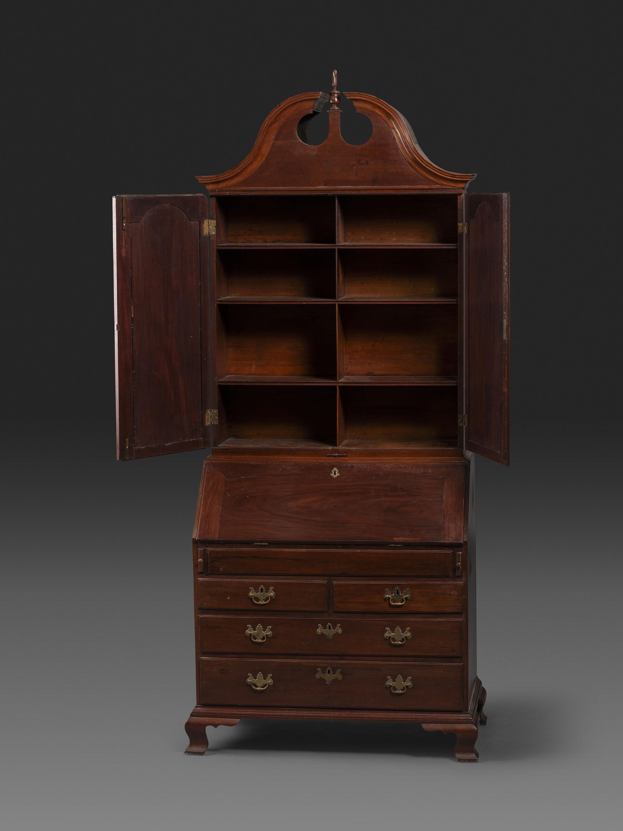 A Chippendale Figured Mahogany Bonnet Top Desk-and-Bookcase