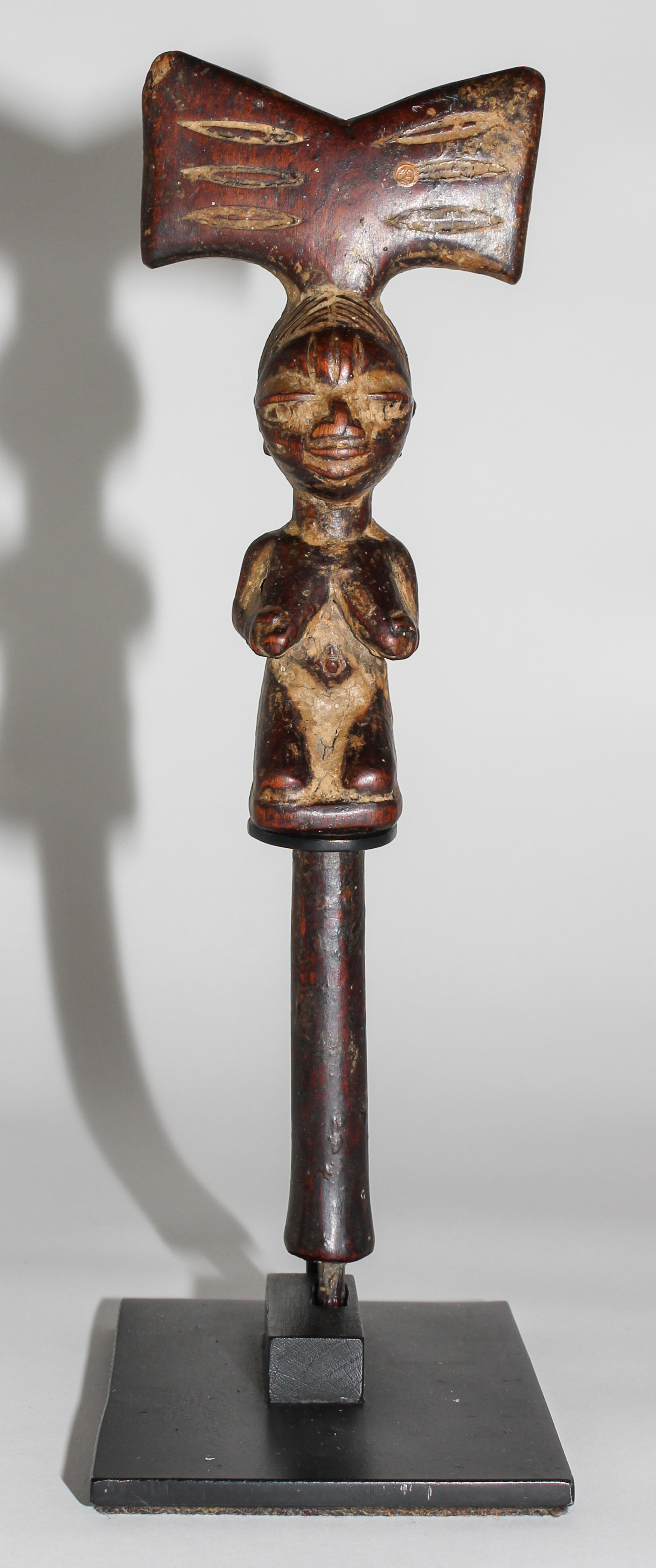 A Yoruba Wood Shango Finial. Height 12 1/4 inches.