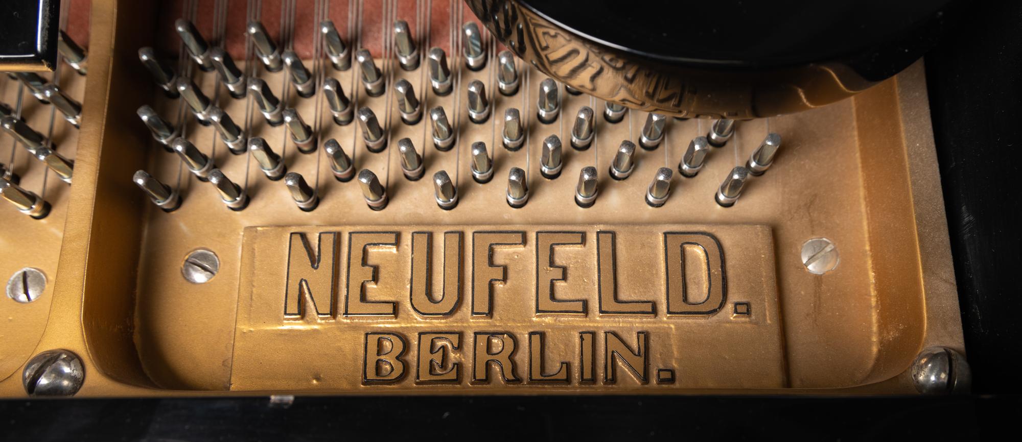 A Neufeld Black Lacquer Grand Piano