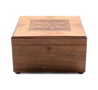 An Imperator Walnut Disk Music Box, Heigth 8 3/8 x width 13 5/8 x depth 13 1/2 inches.