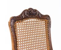 A Pair of Louis XV Carved Walnut Side Chairs