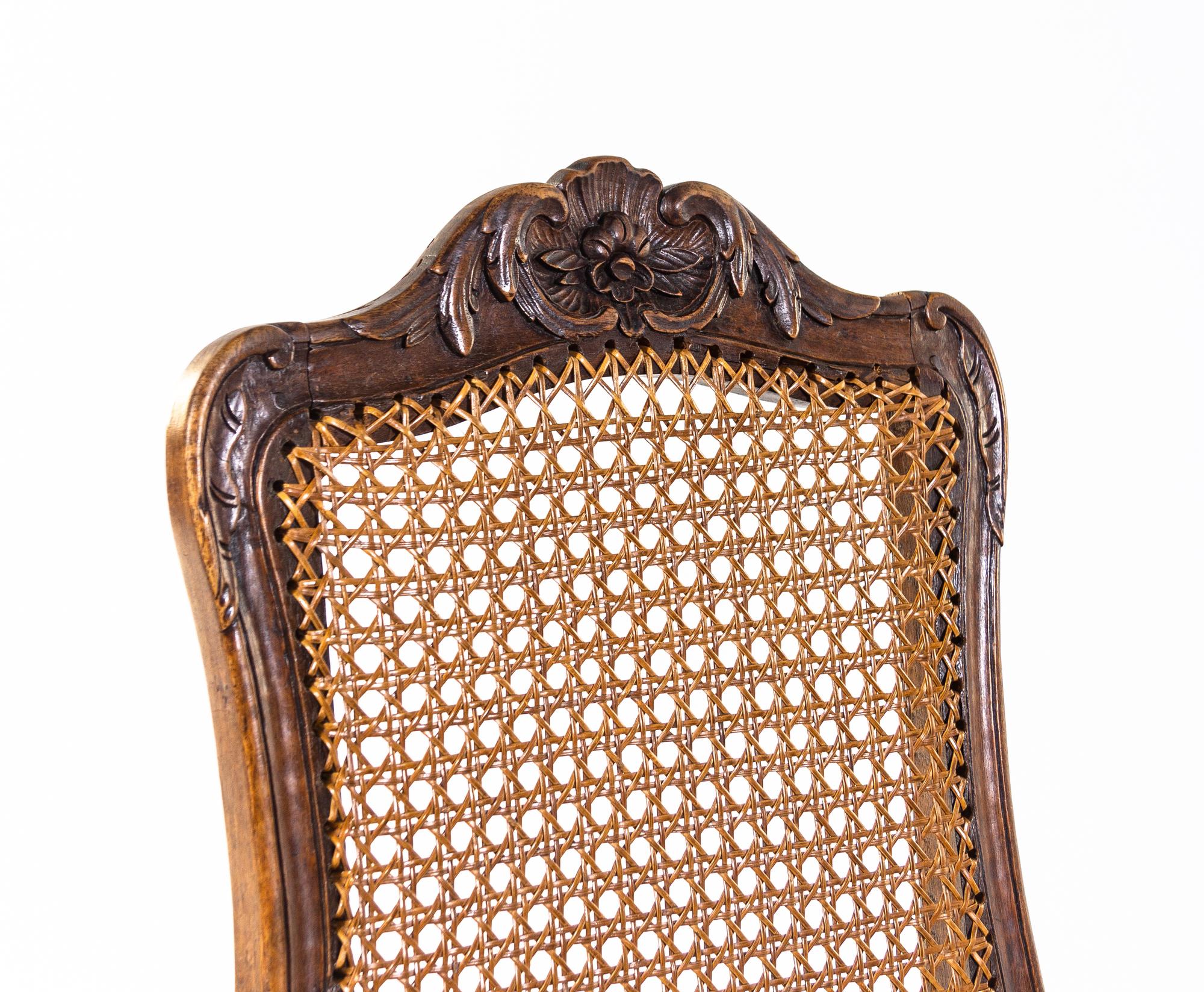 A Pair of Louis XV Carved Walnut Side Chairs