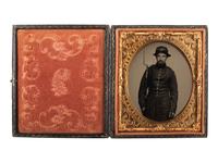 [CIVIL WAR]. Exceptionally clear sixth plate ruby ambrotype of armed New Hampshire infantryman. Ca early 1860s.