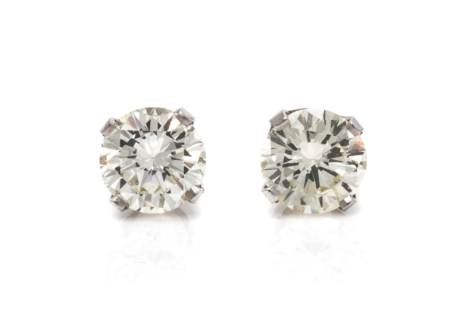 A Pair of 18 Karat White Gold and Diamond Stud Earrings, 0.80 dwts.
