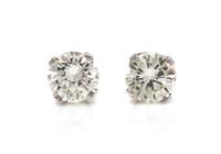 A Pair of 18 Karat White Gold and Diamond Stud Earrings, 0.80 dwts.
