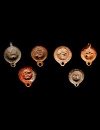 Six Roman Molded Terra Cotta Oil Lamps