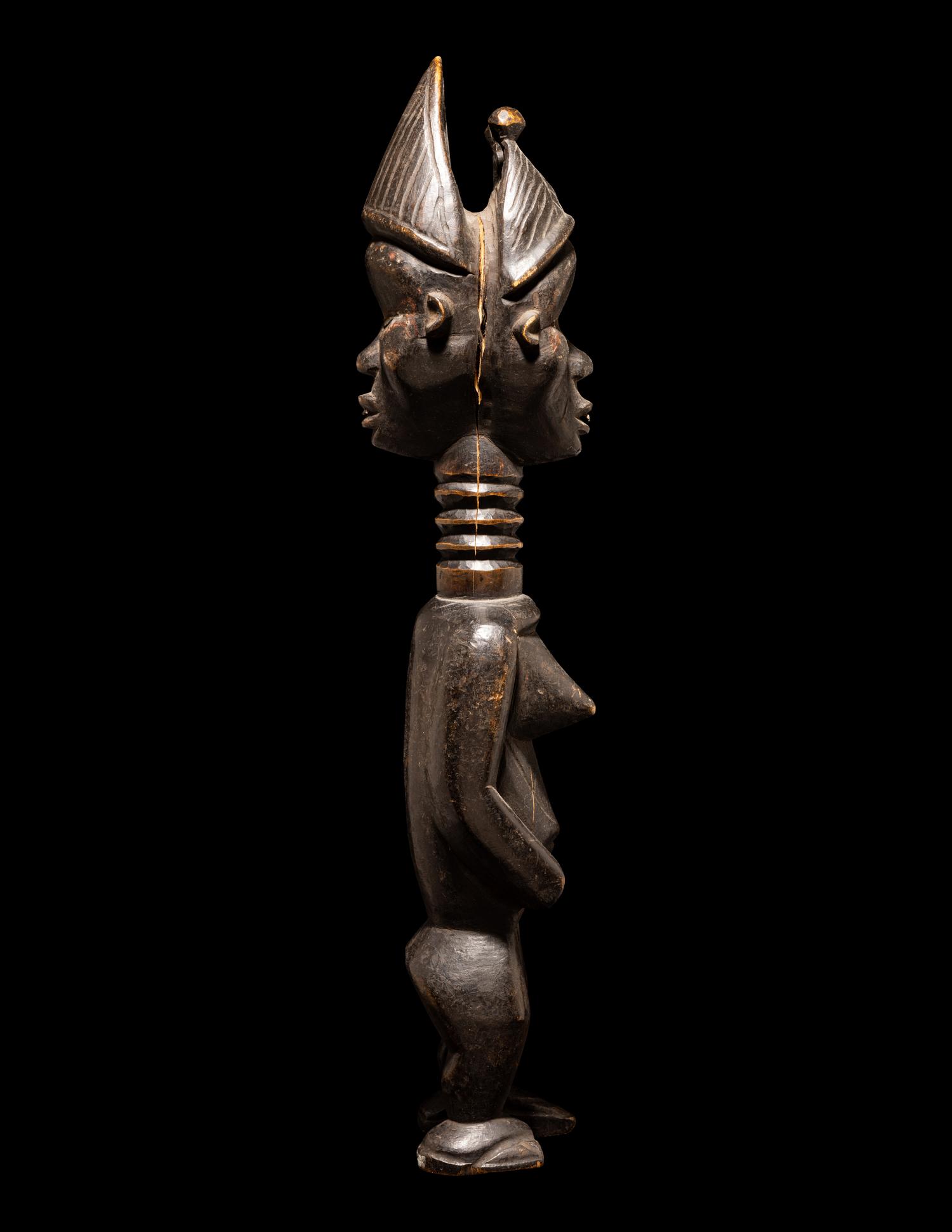 A Baule Wood Janus-Headed Figure