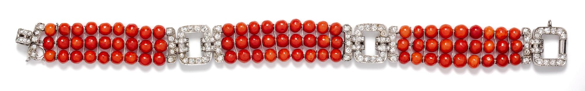An Art Deco Platinum, Diamond and Coral Bead Bracelet, 18.40 dwts.
