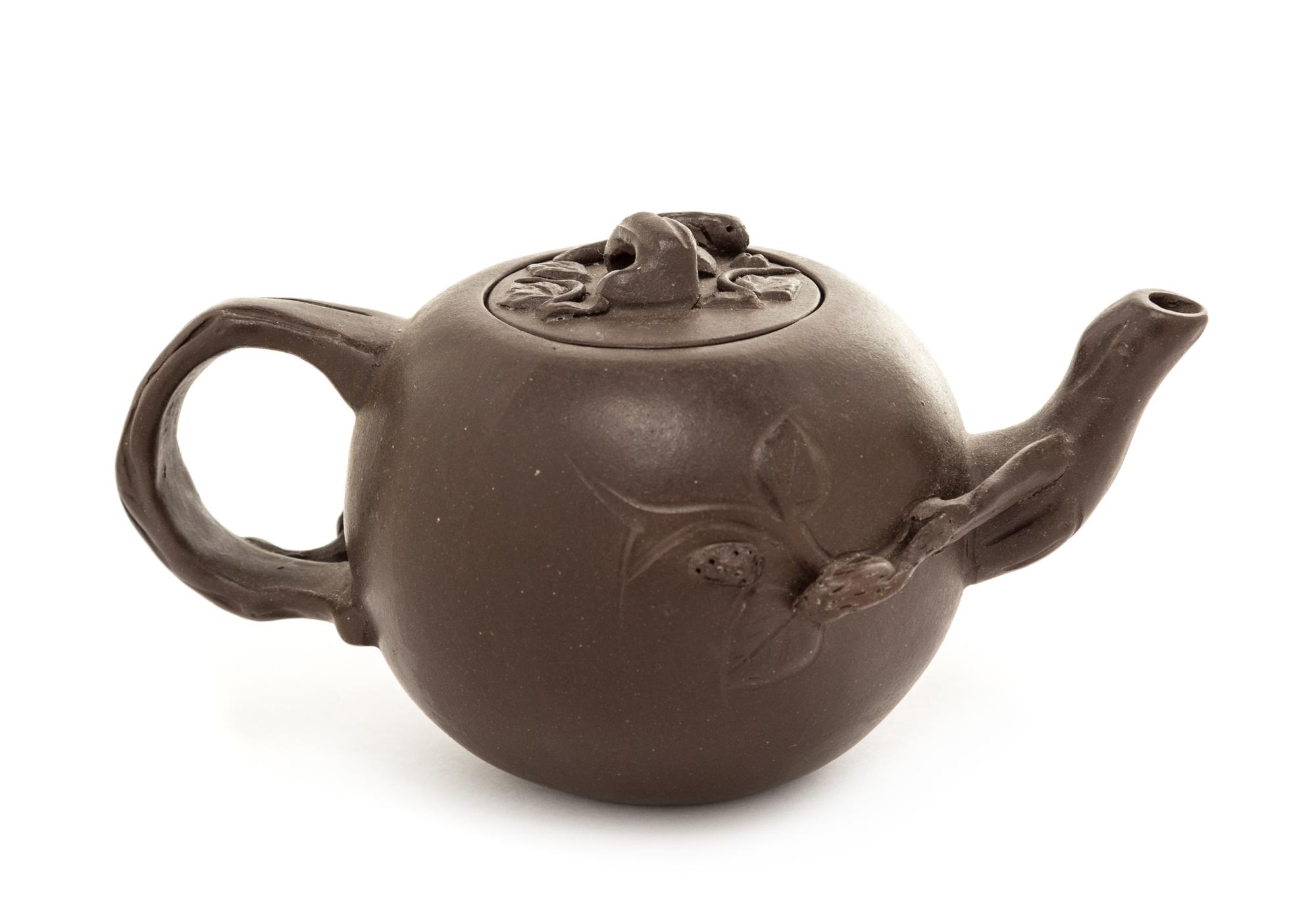 A Yixing Pottery Teapot Height 2 1/2 inches.