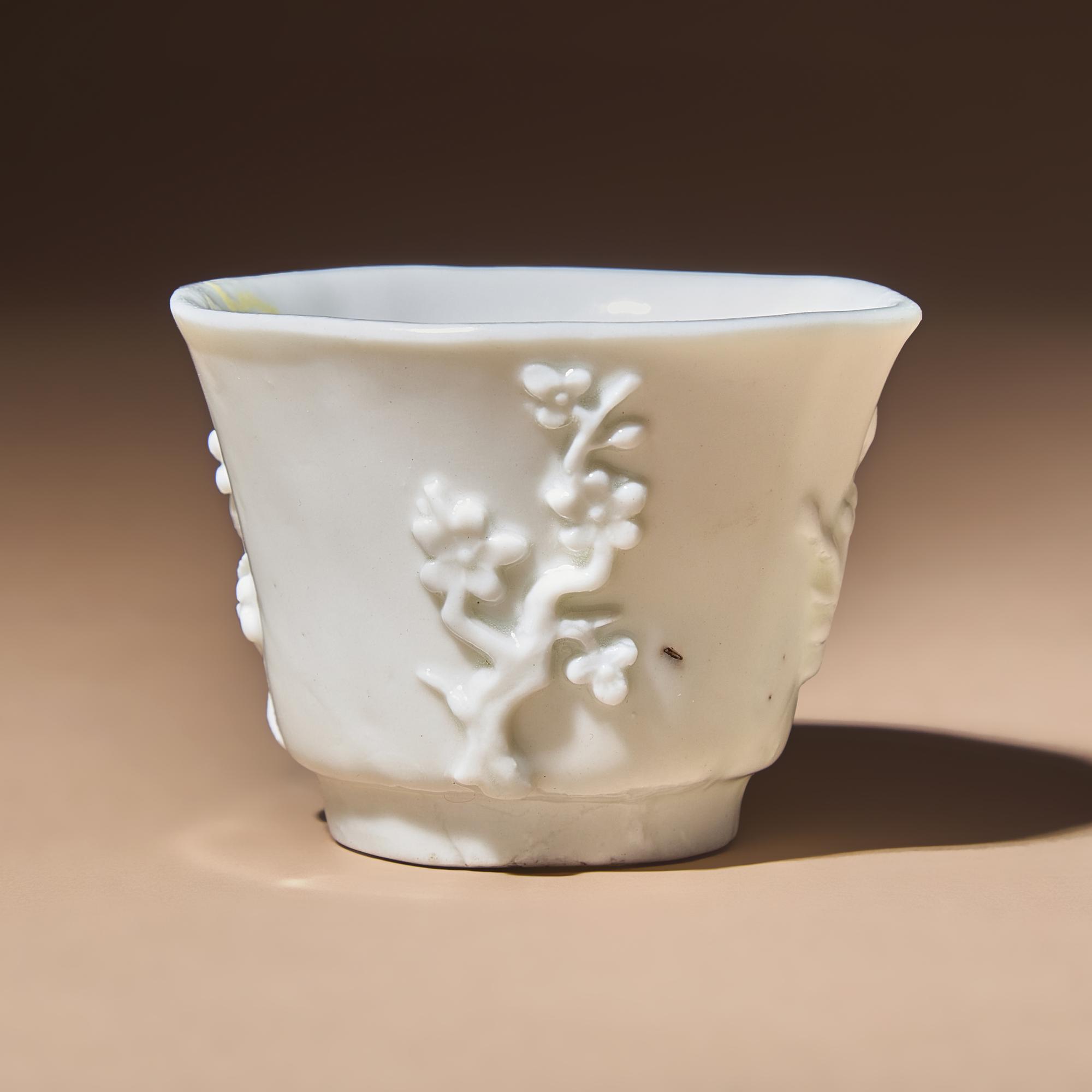 A Chinese Blanc-de-Chine Porcelain Cup, 17th Century — 明末清初 德化白瓷貼塑梅紋花口杯