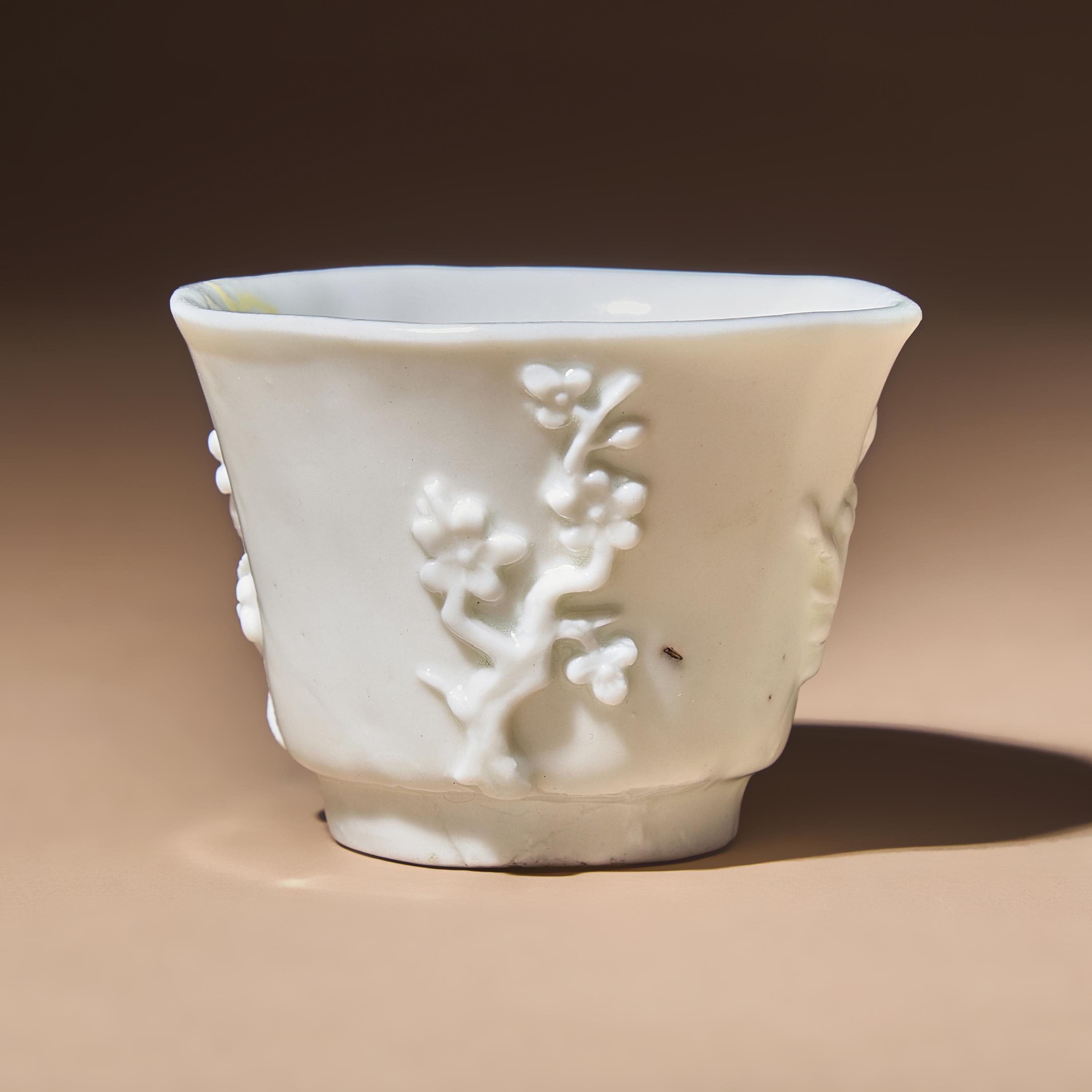 A Chinese Blanc-de-Chine Porcelain Cup, 17th Century — 明末清初 德化白瓷貼塑梅紋花口杯