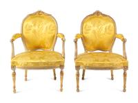 A Matched Pair of George III White-Painted and Parcel-Gilt Armchairs