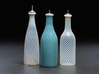 Three Opalescent Swirl Glass Barber Bottles
