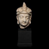A Gandharan Stucco Head of Maitreya, Hadda Region, 4th/5th Century