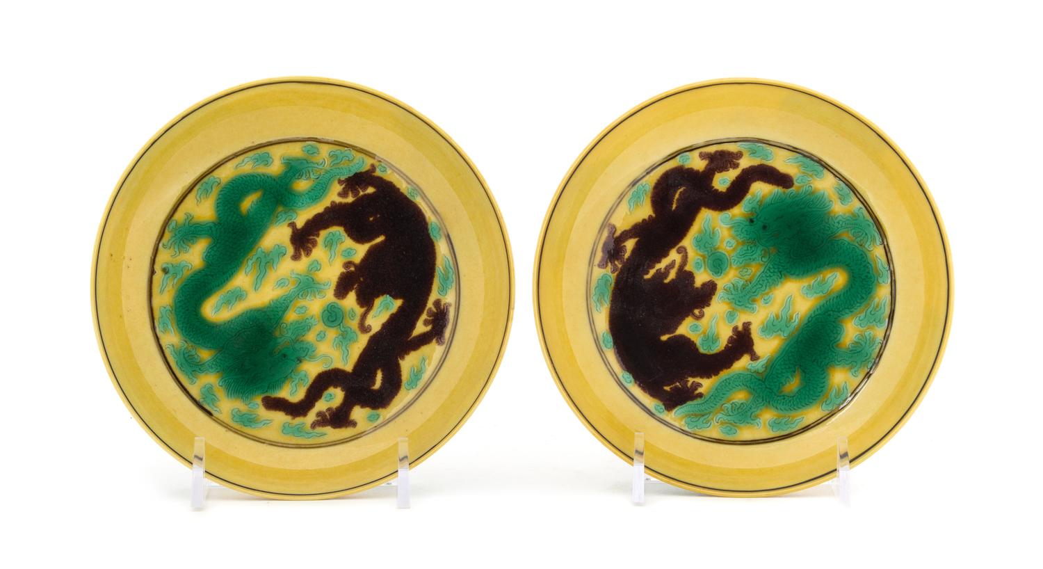 A Pair of Yellow Ground Green and Purple Glazed Porcelain Saucer Dishes — POSSIBLY KANGXI PERIOD (1661-1722)