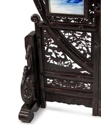 A Chinese Blue and White Porcelain-Mounted Carved Hardwood Four Panel Floor Screen