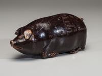 An Anna Pottery Incised and Brown Glazed Pig Flask