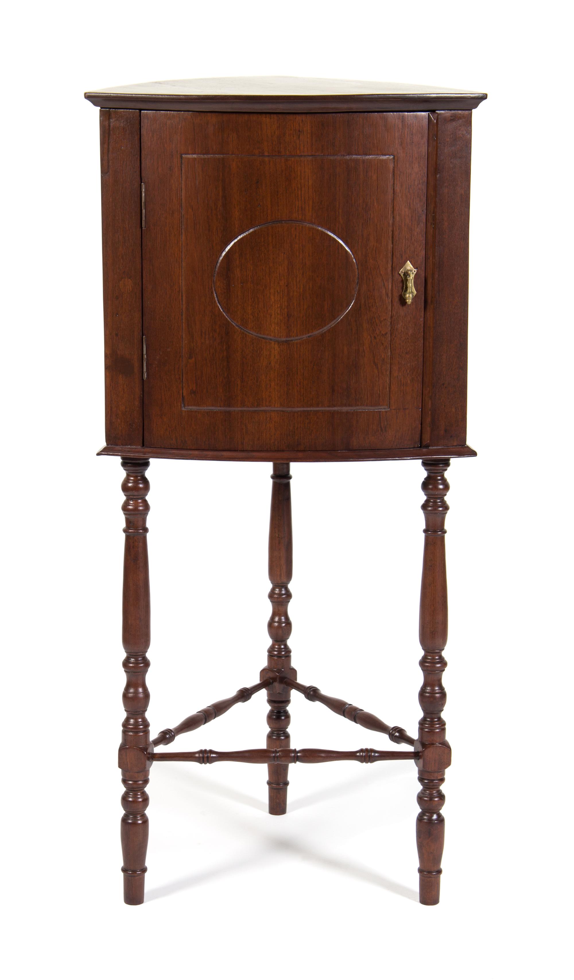 An American Mahogany Corner Cabinet Height 50 inches.