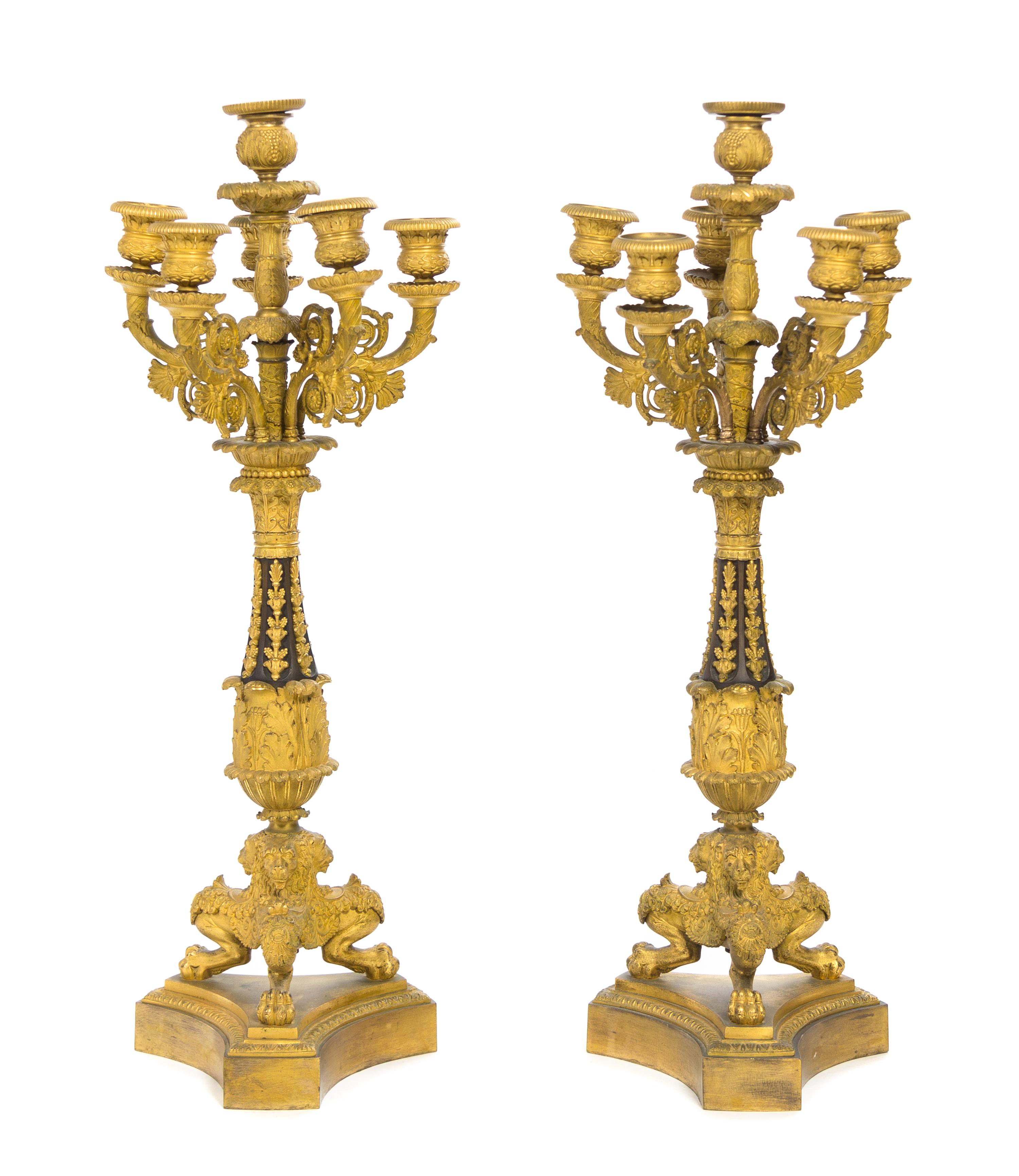 A Pair of Louis Philippe Gilt and Patinated Bronze Six-Light Candelabra Height 26 inches.