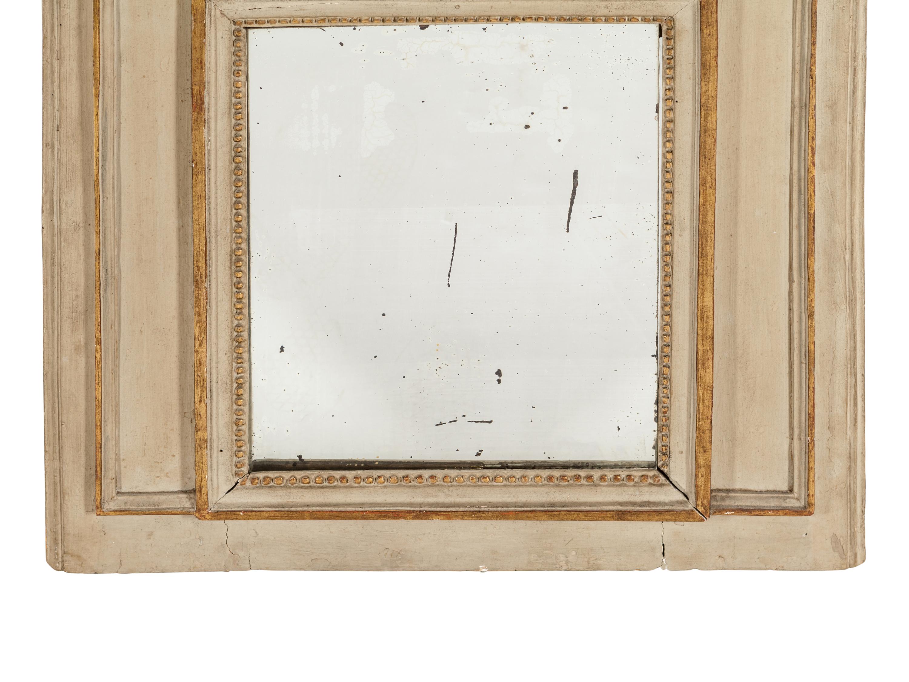 A Louis XVI Style Gray Painted and Parcel Gilt Mirror