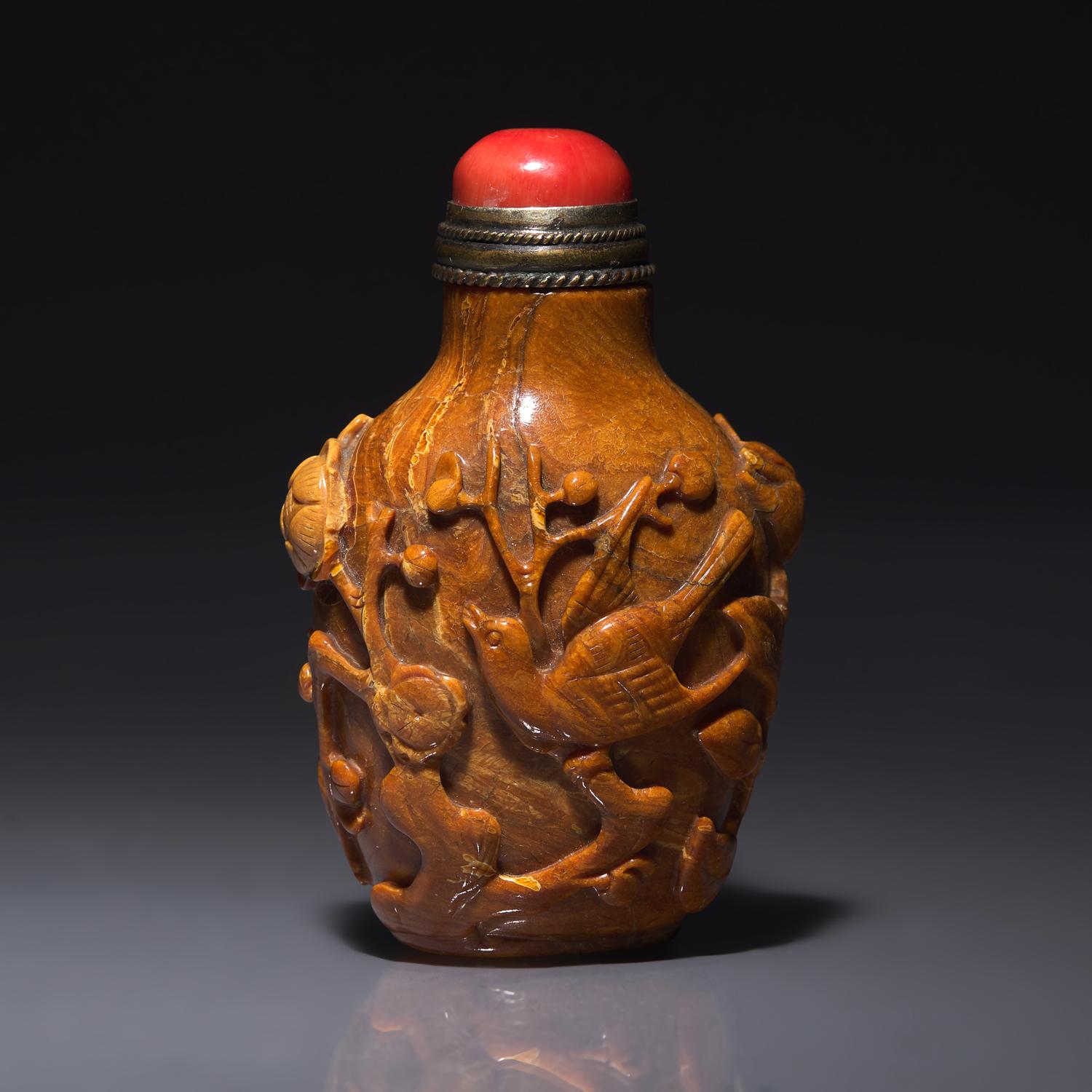 A Chinese Bird and Flower-Carved Root Amber Snuff Bottle 琥珀雕花鳥鼻烟壺