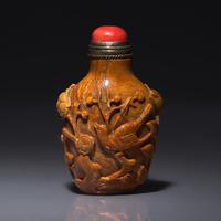 A Chinese Bird and Flower-Carved Root Amber Snuff Bottle 琥珀雕花鳥鼻烟壺