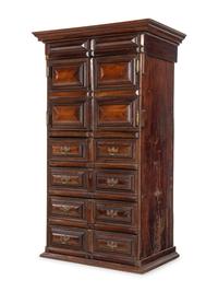 A Dutch Carved and Paneled Walnut Tall Chest of Drawers