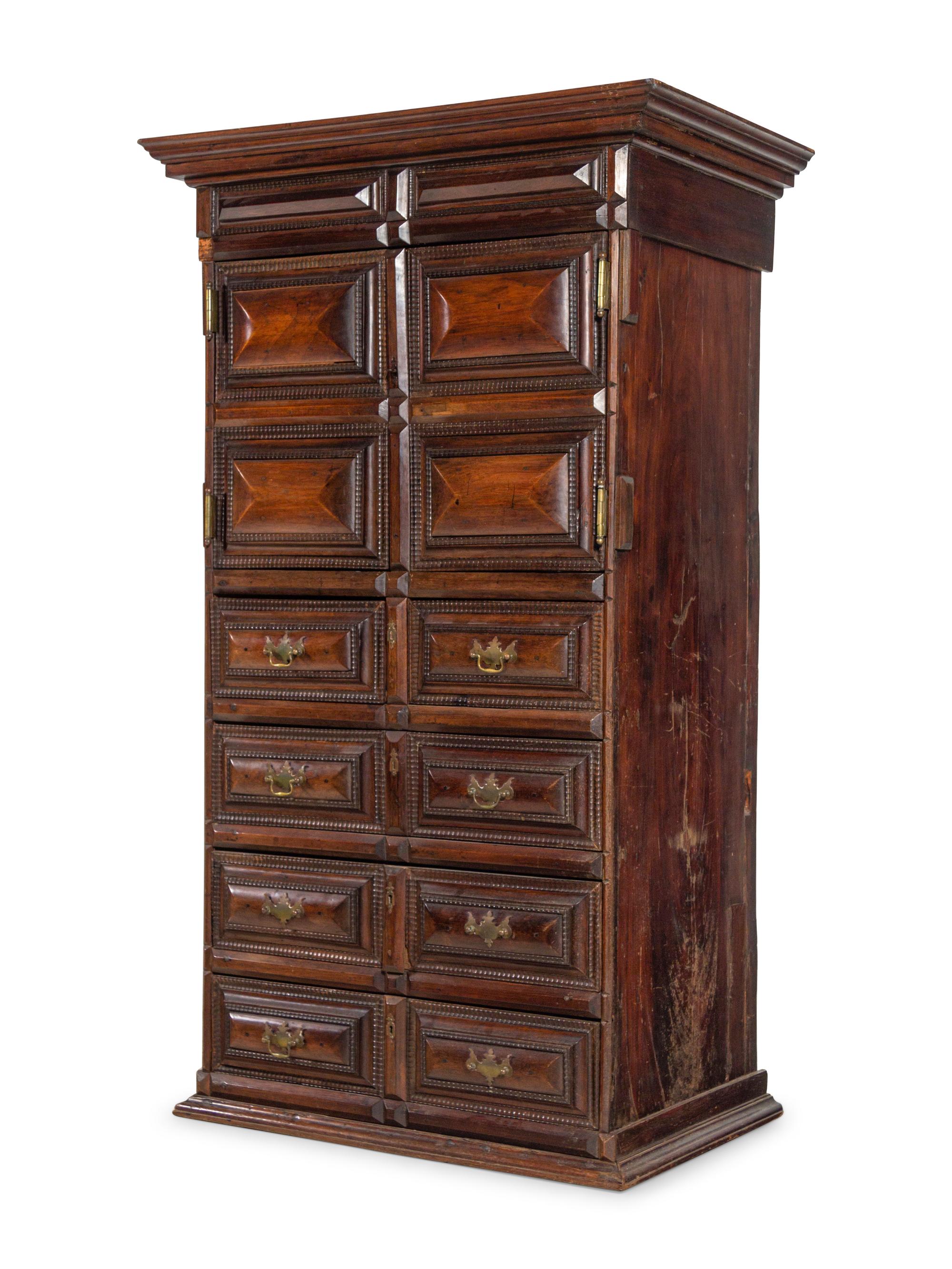 A Dutch Carved and Paneled Walnut Tall Chest of Drawers