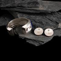 Michael L. Slim AND Knifewing Segura (Diné, act. since 1980s) AND (Chiricahua Apache, 20th century) — Sterling Silver and Lapis Cuff Bracelet and Post Earrings