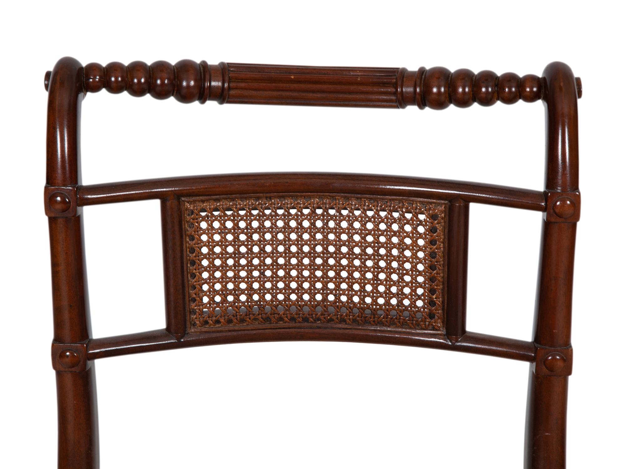 A Set of Four Regency Style Mahogany Cane Seat Dining Chairs