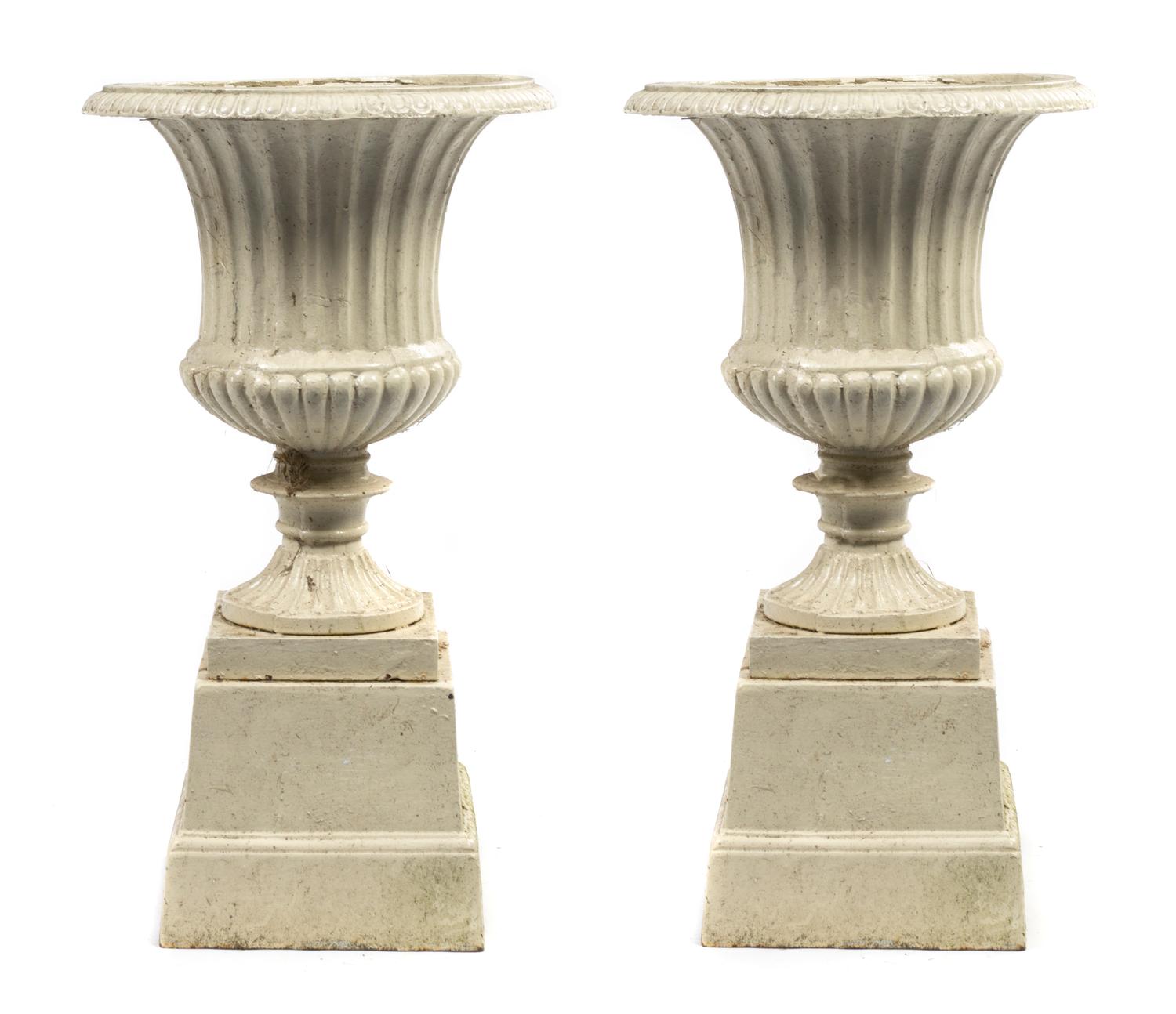 A Pair of Victorian Cast Iron Urns, Height 27 inches.