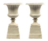 A Pair of Victorian Cast Iron Urns, Height 27 inches.