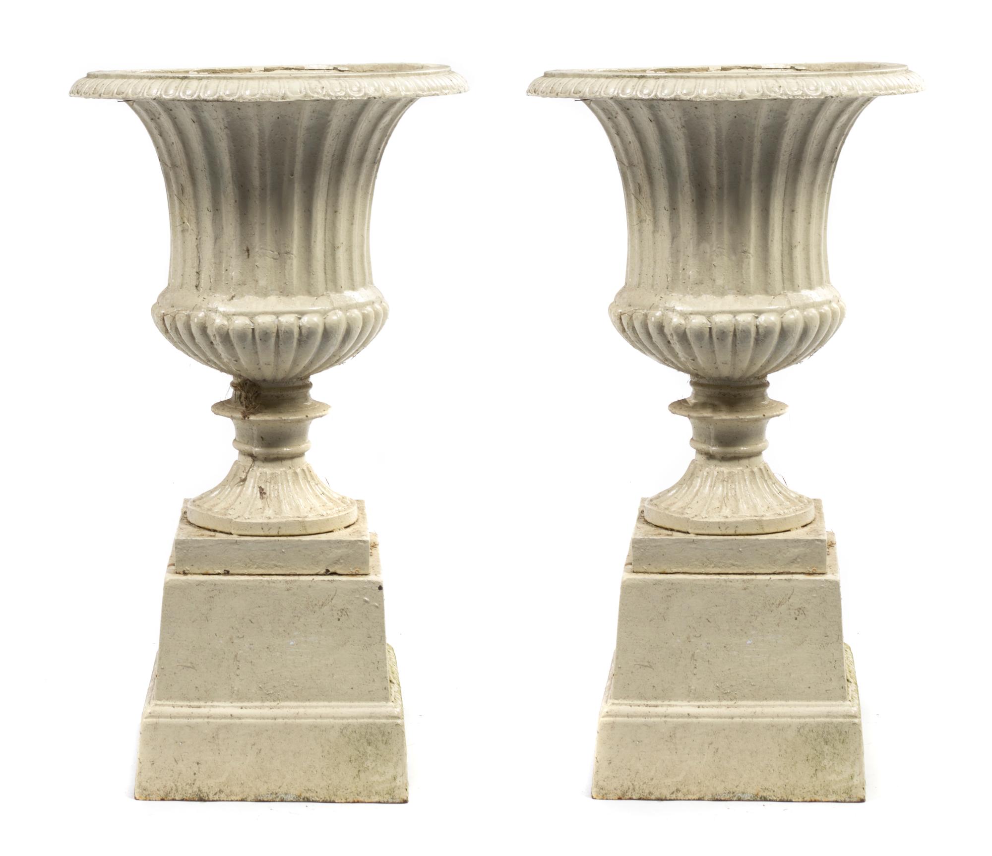 A Pair of Victorian Cast Iron Urns, Height 27 inches.
