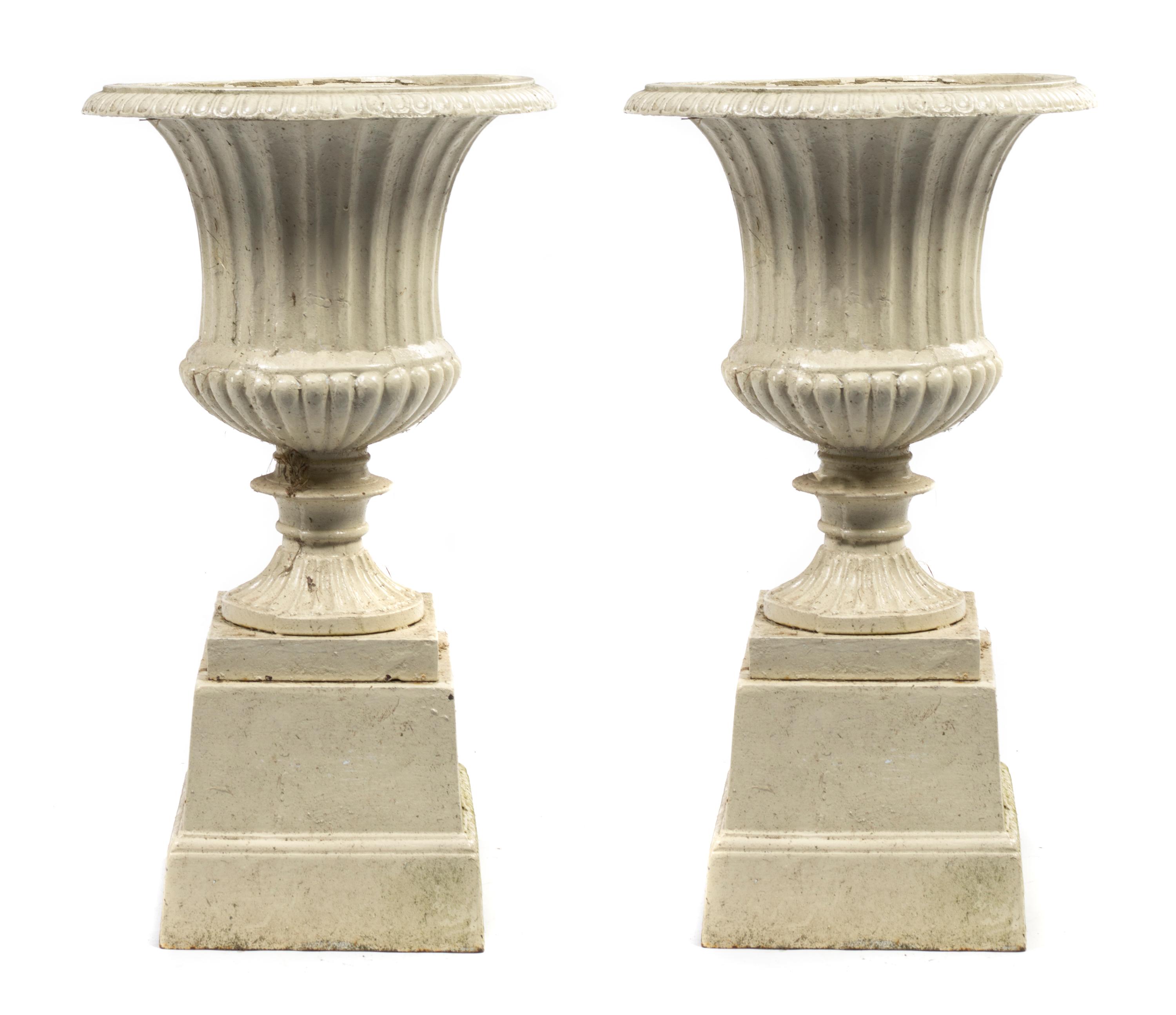 A Pair of Victorian Cast Iron Urns, Height 27 inches.