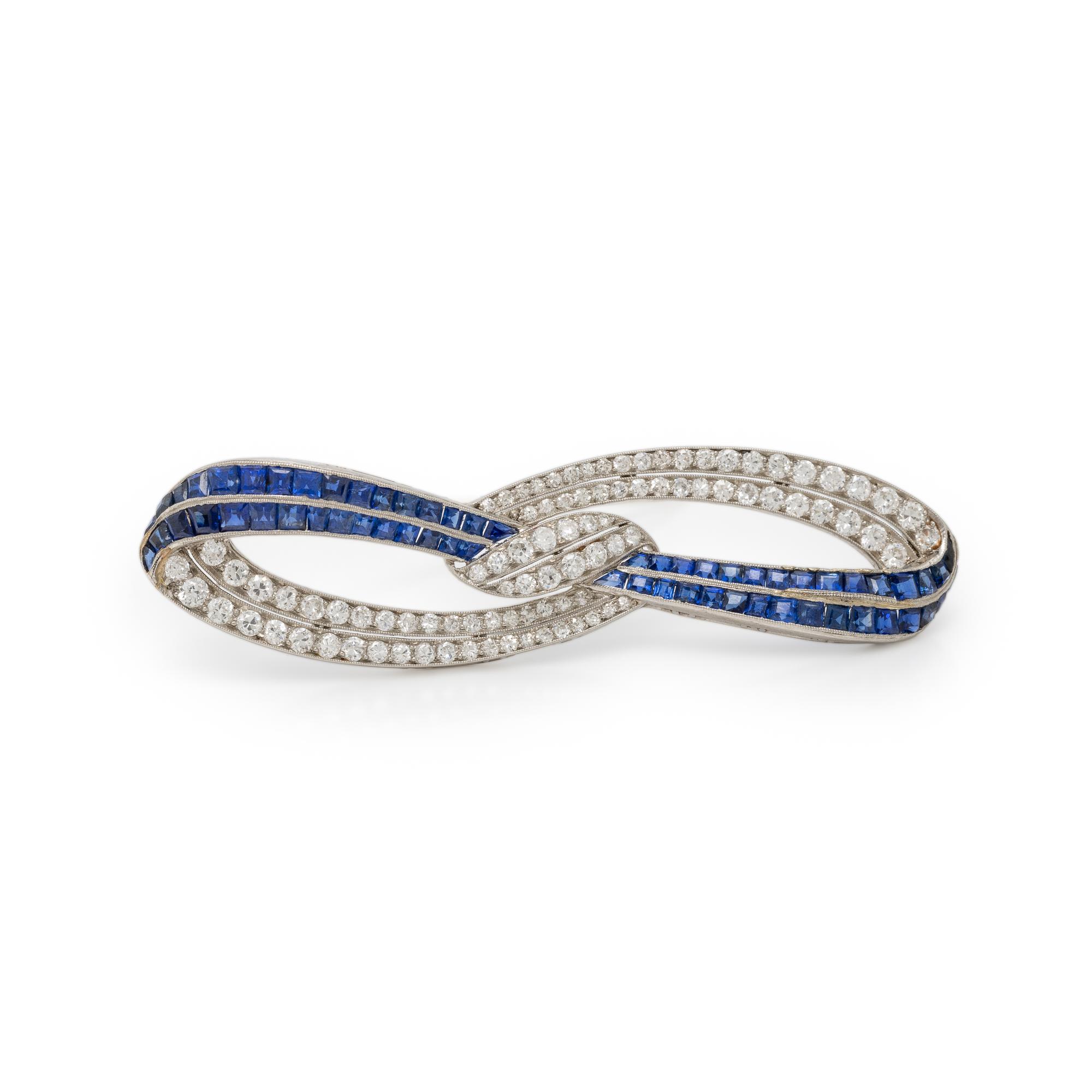 PLATINUM, DIAMOND, AND SAPPHIRE BOW BROOCH