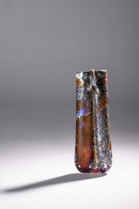 A Roman Purple Glass Double Unguentarium — .